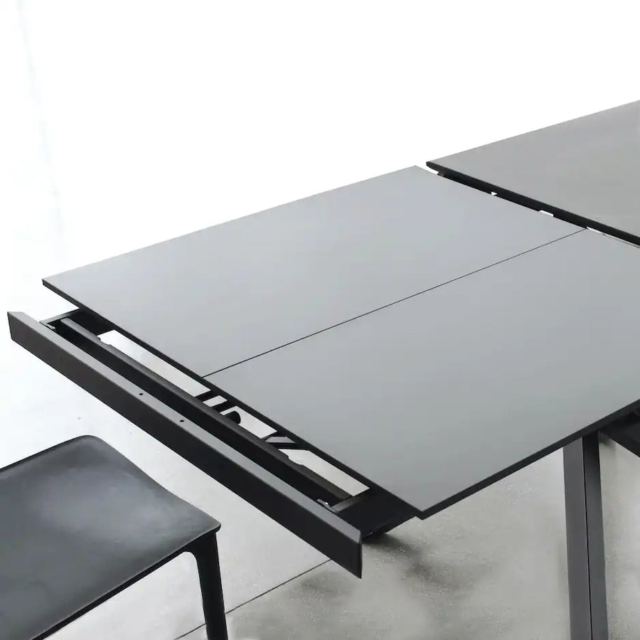 Compatta extending dining table - Space saving dining tables - Spaceman Singapore - Featuring Compatta with matte ceramic top - Concealed melamine extension panel unfolding like a book.